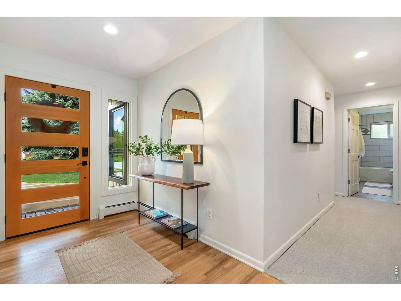 Remodeled mid-century ranch on over half an acre of mature lot. 