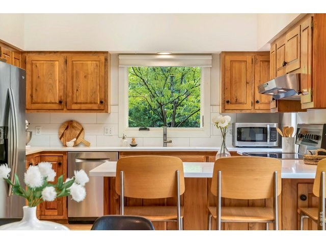 Property Photo 9 Kitchen with an open floorplan perfect for entertaining, extra seating, and prep. 