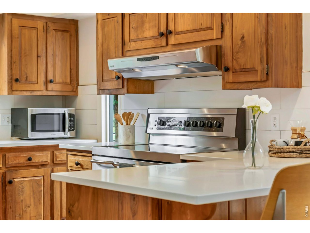 New quartz countertops and subway tile backsplash in the kitchen.