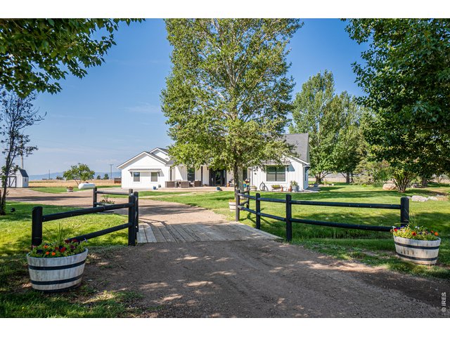 Property Photo 6 Minutes to Old town Fort Collins. This property has it all. Luxury home, Barn, Pond, RV Garage/Shop, 35 acres, Arena...