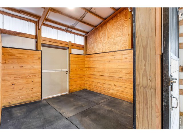 Property Photo 17 1 of 6 stalls all with rubber mats and waterers. Stall 1 features a video camera
