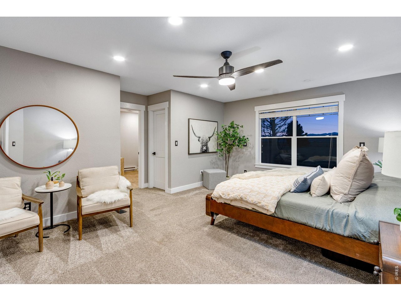 Luxurious primary bedroom with retreat featuring a 5-piece bath and two walk-in closets.