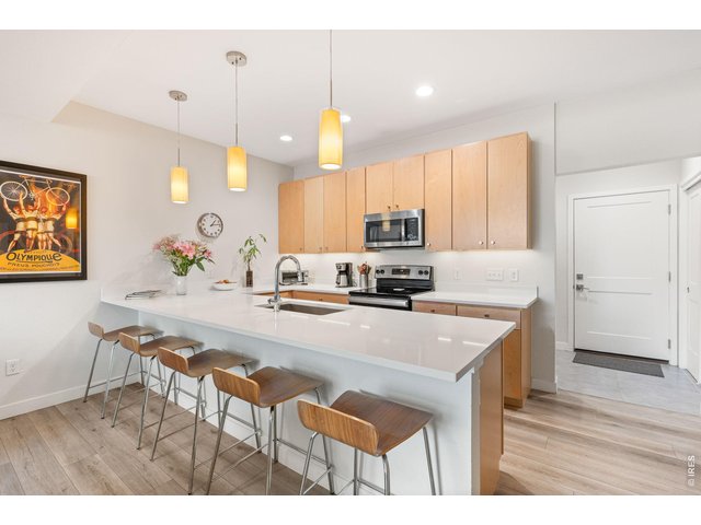 Property Photo 3 Modern, sleek, and functional kitchen with electric appliances