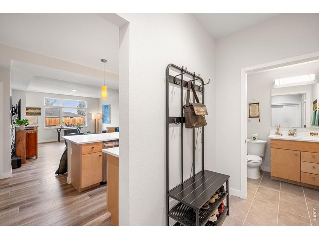 Property Photo 9 Entryway from garage + powder room