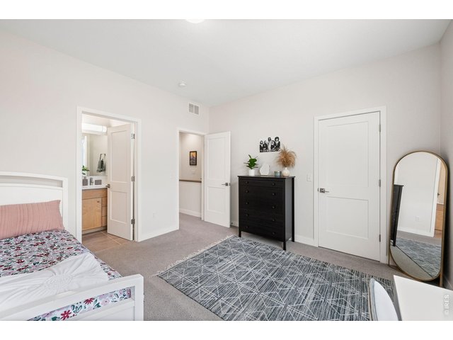 Property Photo 14 Secondary bedroom with en suite full bath