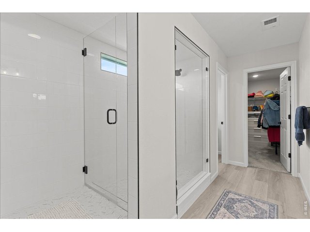 Property Photo 28 Primary bath w/ large shower and walkin closet 