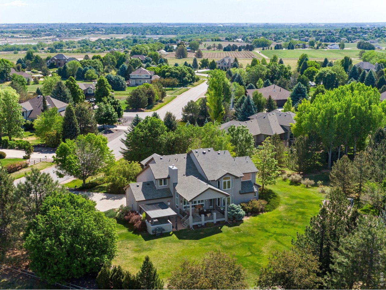 Tucked away on private lot in desirable Highland Hills, an exceptional residence offering a rare blend of privacy, space + refined comfort on nearly a full acre within the Poudre School District. 4,741 finished square feet, 5 Bdrms & 5 Baths.
