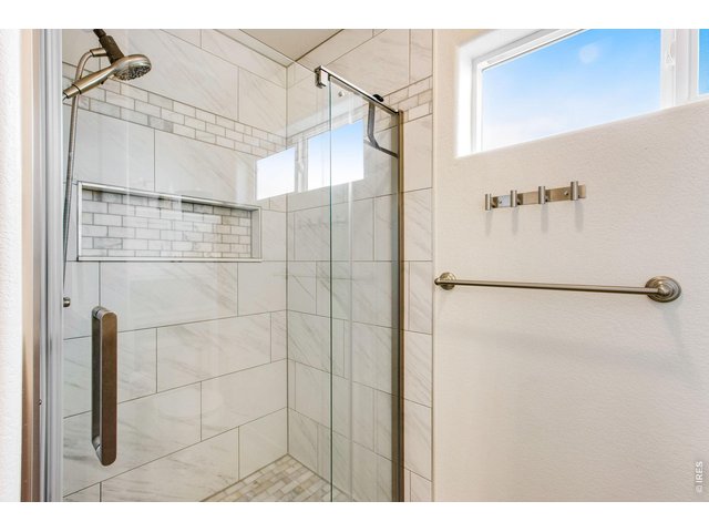 Property Photo 26 Remodeled tile shower in primary bathroom