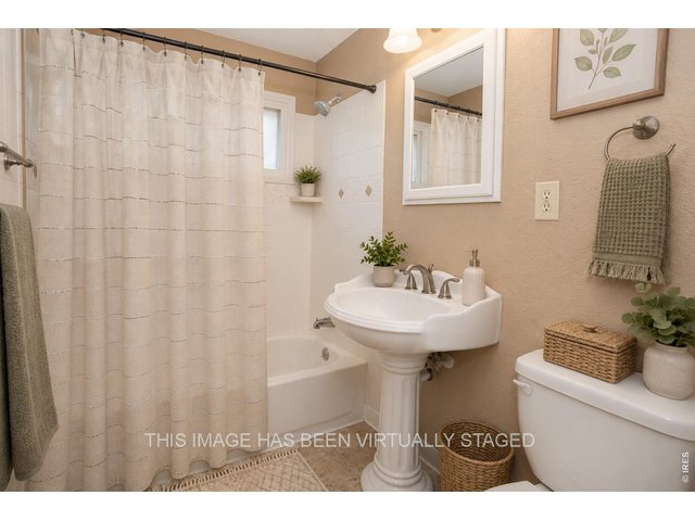 Property Photo 27 Bathroom- virtually staged