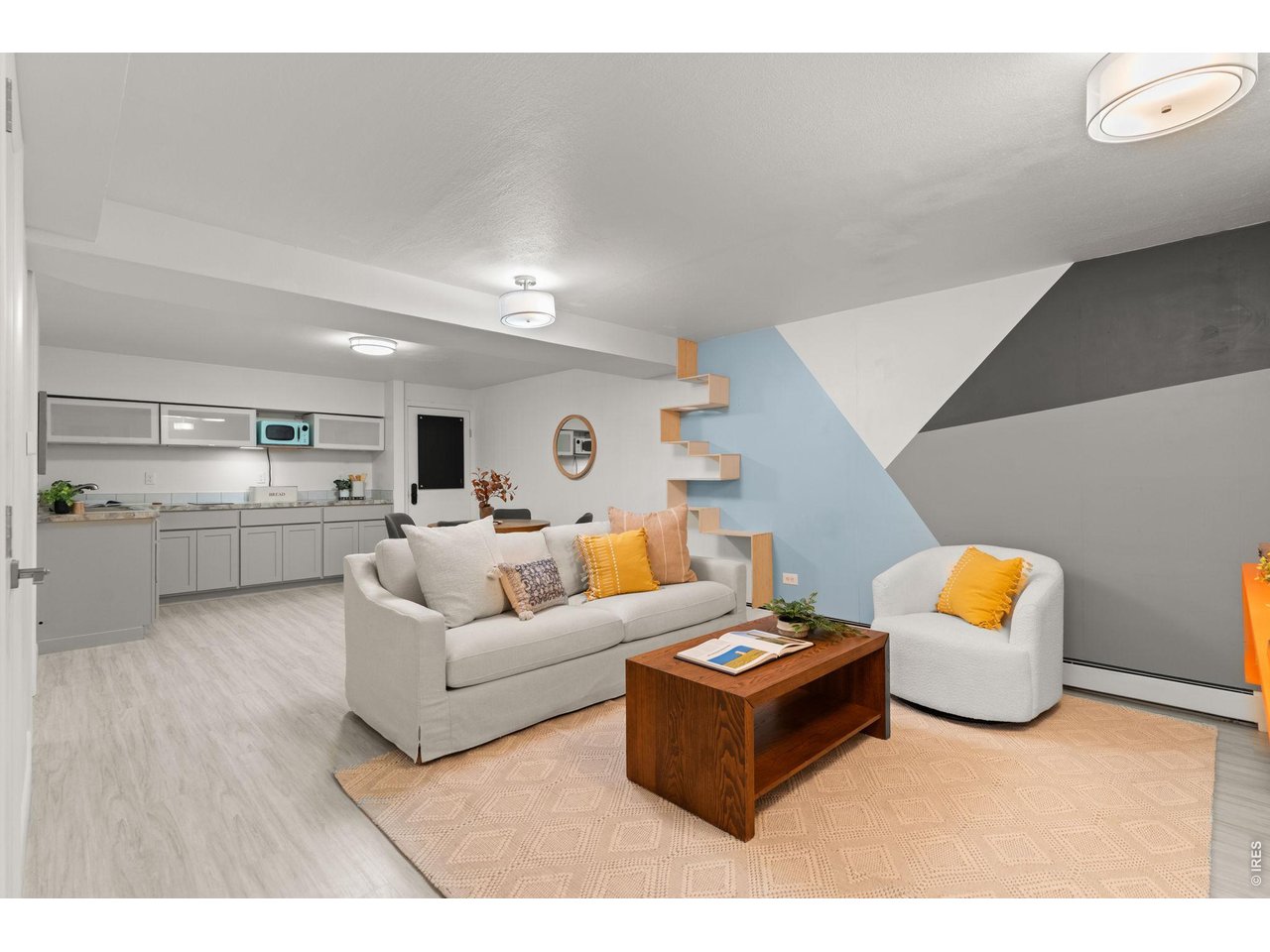 Mother-in-law suite in basement features a secondary living area, two bedrooms, kitchenette, bathroom, laundry, and abundant storage