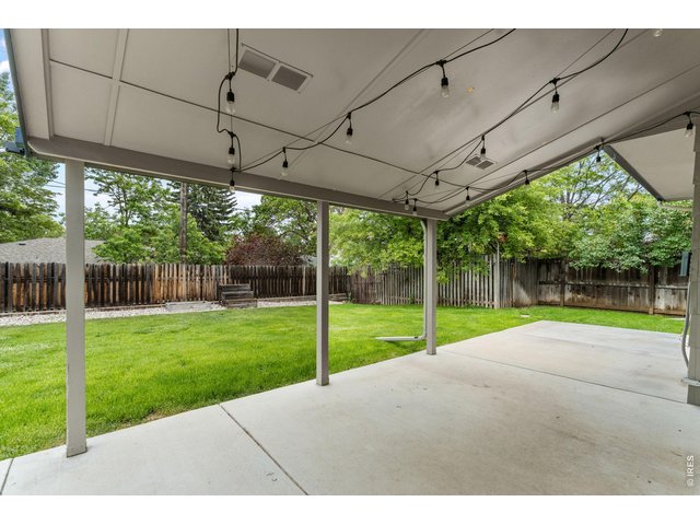 Property Photo 43 Covered patio in the backyard