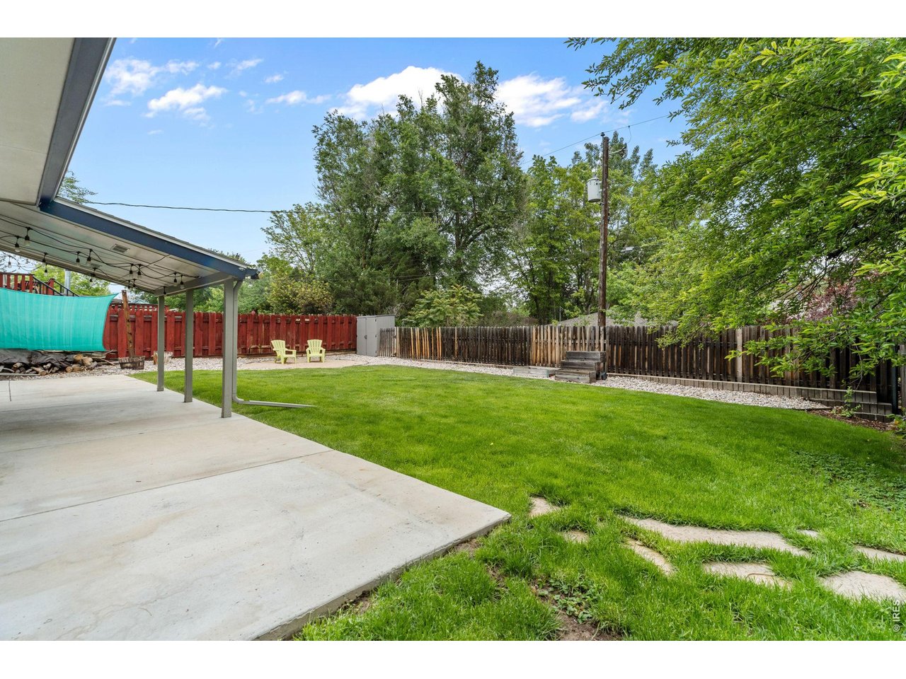 The backyard offers a fire pit area, chicken run, and dedicated hot tub pad with electricity in place