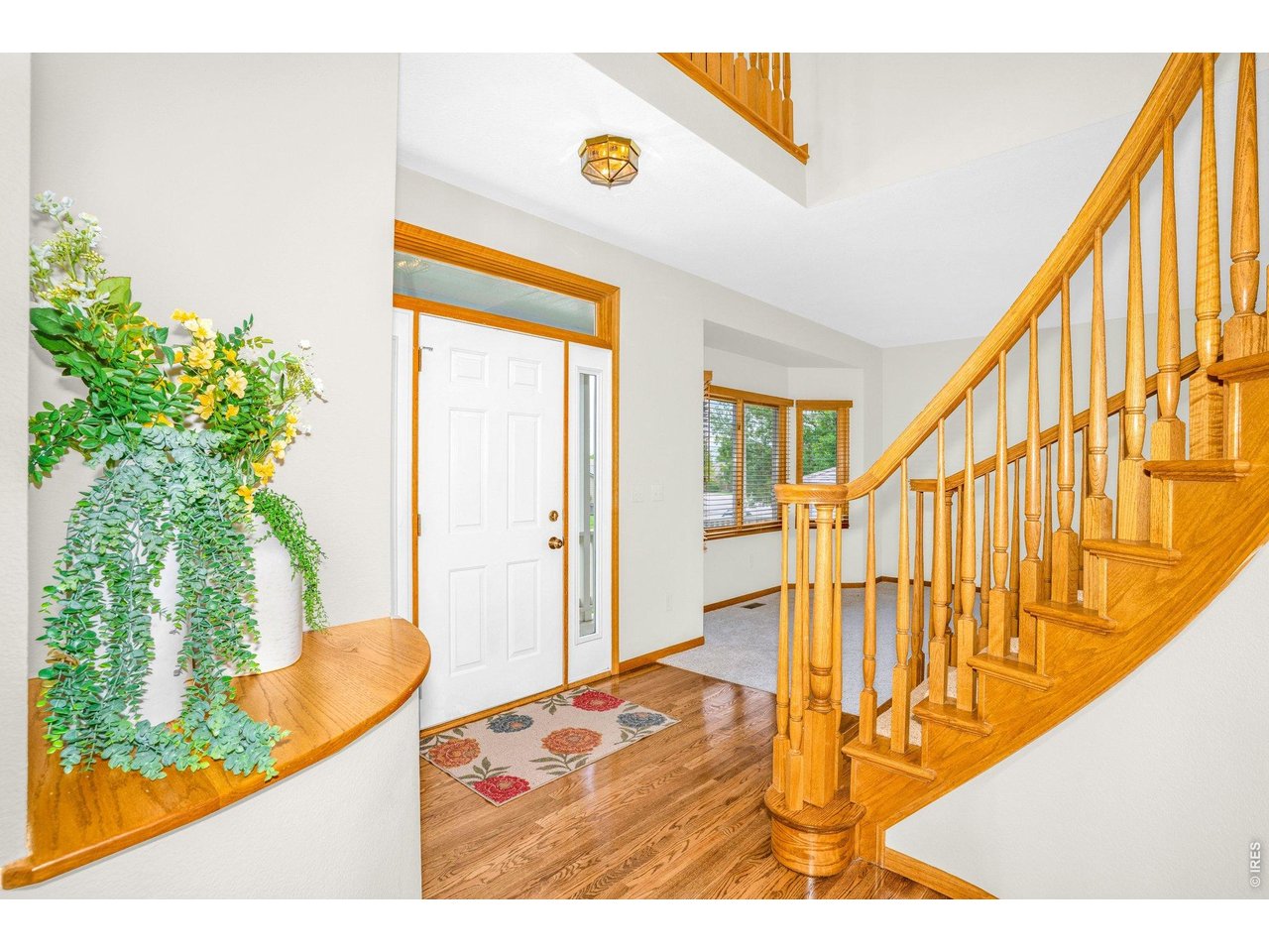 Enter the grand foyer with vaulted ceiling and beautiful wooden staircase leading to your second level. 