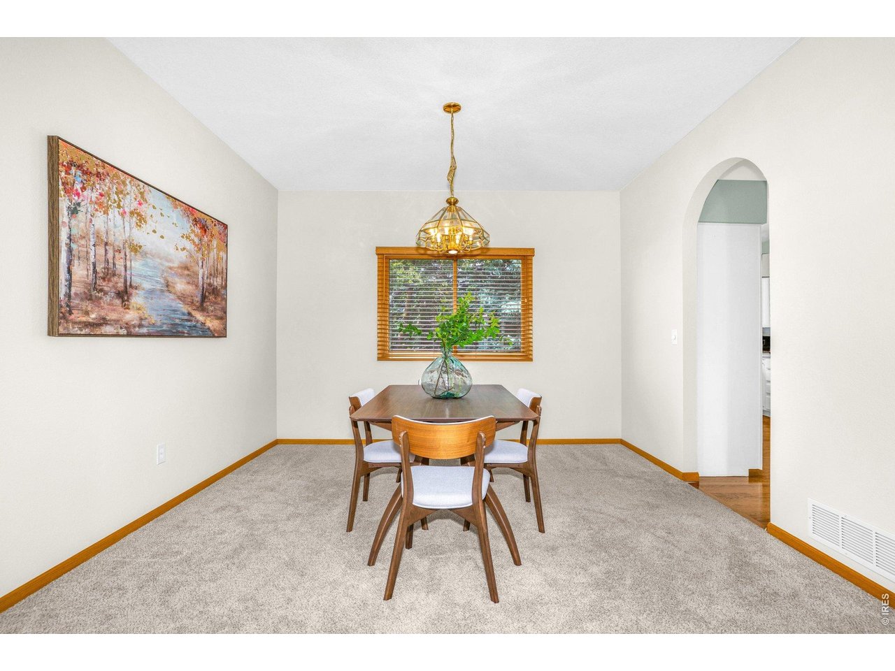 The formal dining room sits next to the kitchen and flows seamlessly from the living room allowing for ease of entertaining guests. 
