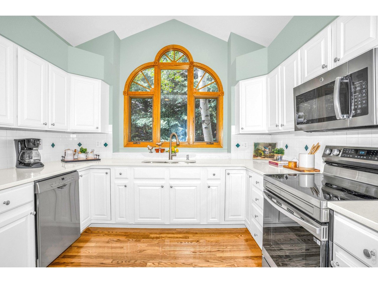 Stainless steel appliances, granite counters, and a white tile backsplash brighten up the heart of the home! 