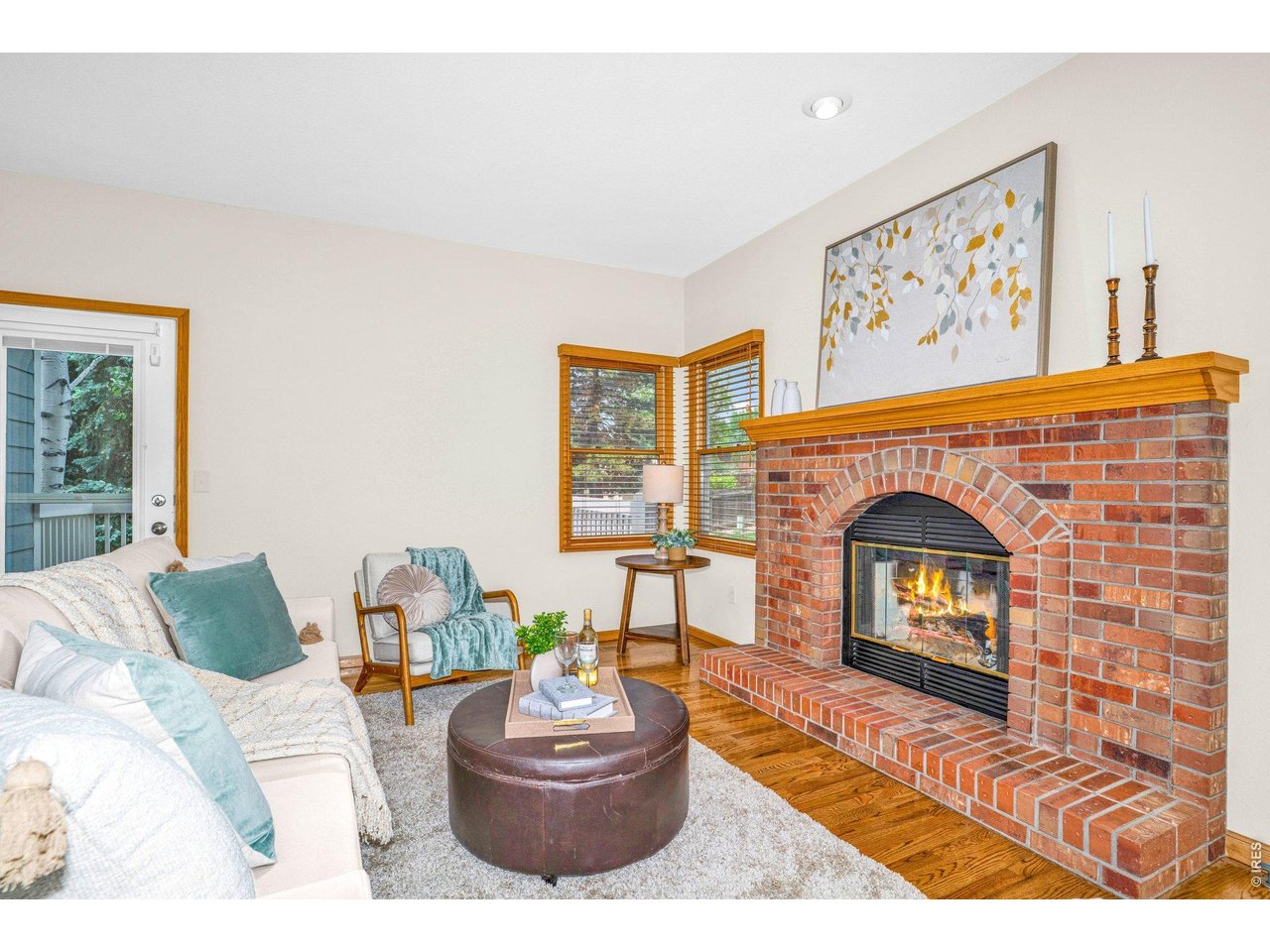 The red brick fireplace with custom mantle is the focal point of the family room and is ideal for chilly Colorado evenings. 