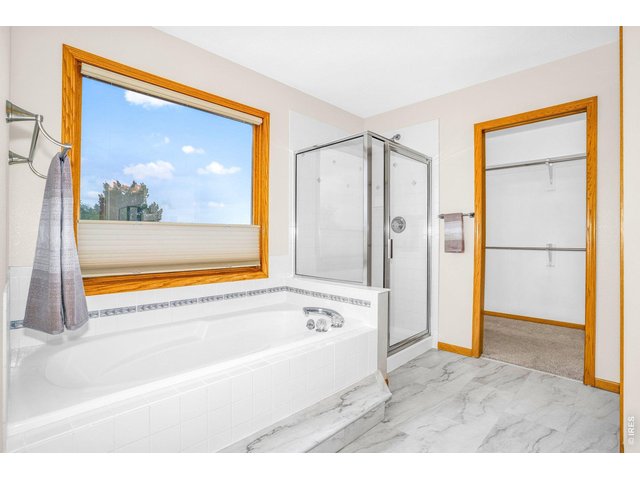 Property Photo 18 5-piece primary bath with soaking tub, walk-in shower...
