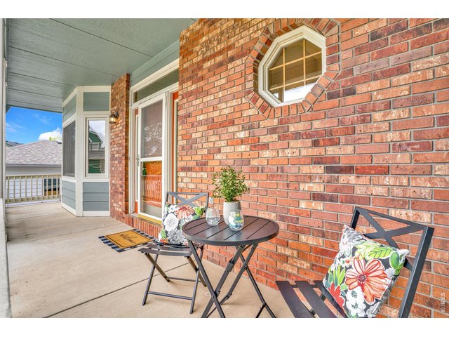 Property Photo 30 The front porch is welcoming and is the perfect spot for morning sun or evening conversations. 