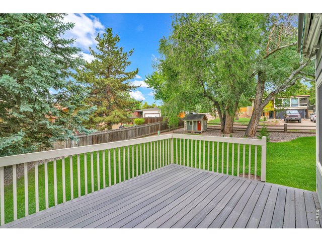 Property Photo 32 The back trex deck overlooking your private parklike backyard. The deck has a shade awning for evening grilling. 