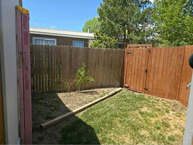 Property Photo 38 Dog run or garden area between two sheds