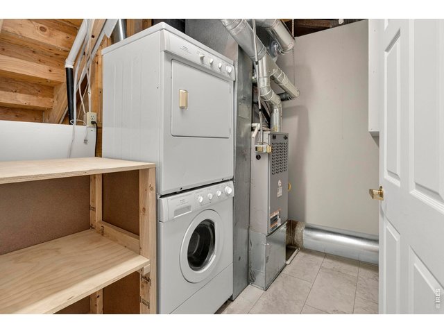 Property Photo 36 The shelves on the left are on rolling casters to allow easy access to the crawlsapce.