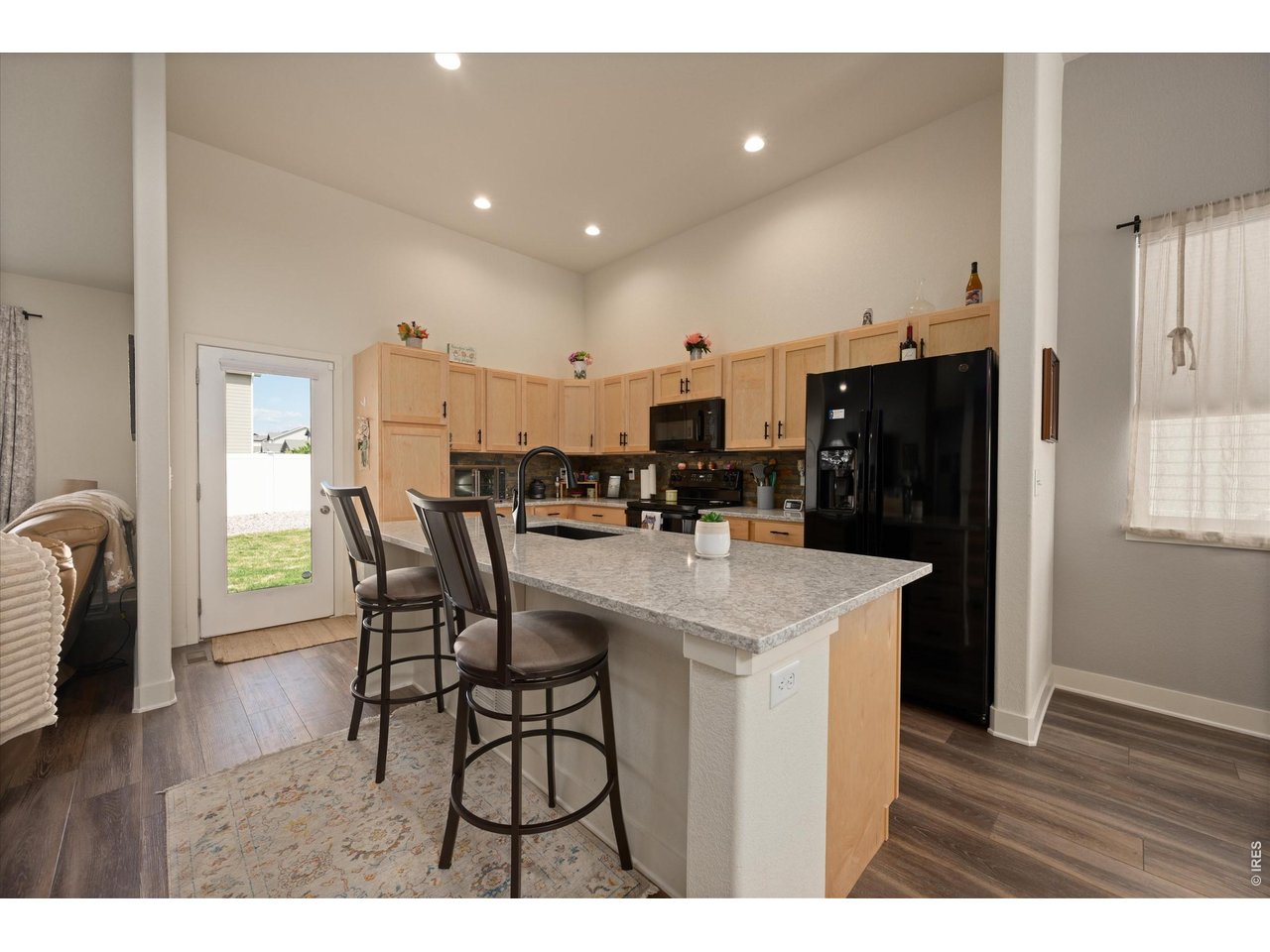 Dream Kitchen! White & Gray Quartz Countertops, Large Island Perfect for Entertaining! Vaulted Ceilings with Canned Lighting, Laminate Hardwoods throughout Much of Main Level