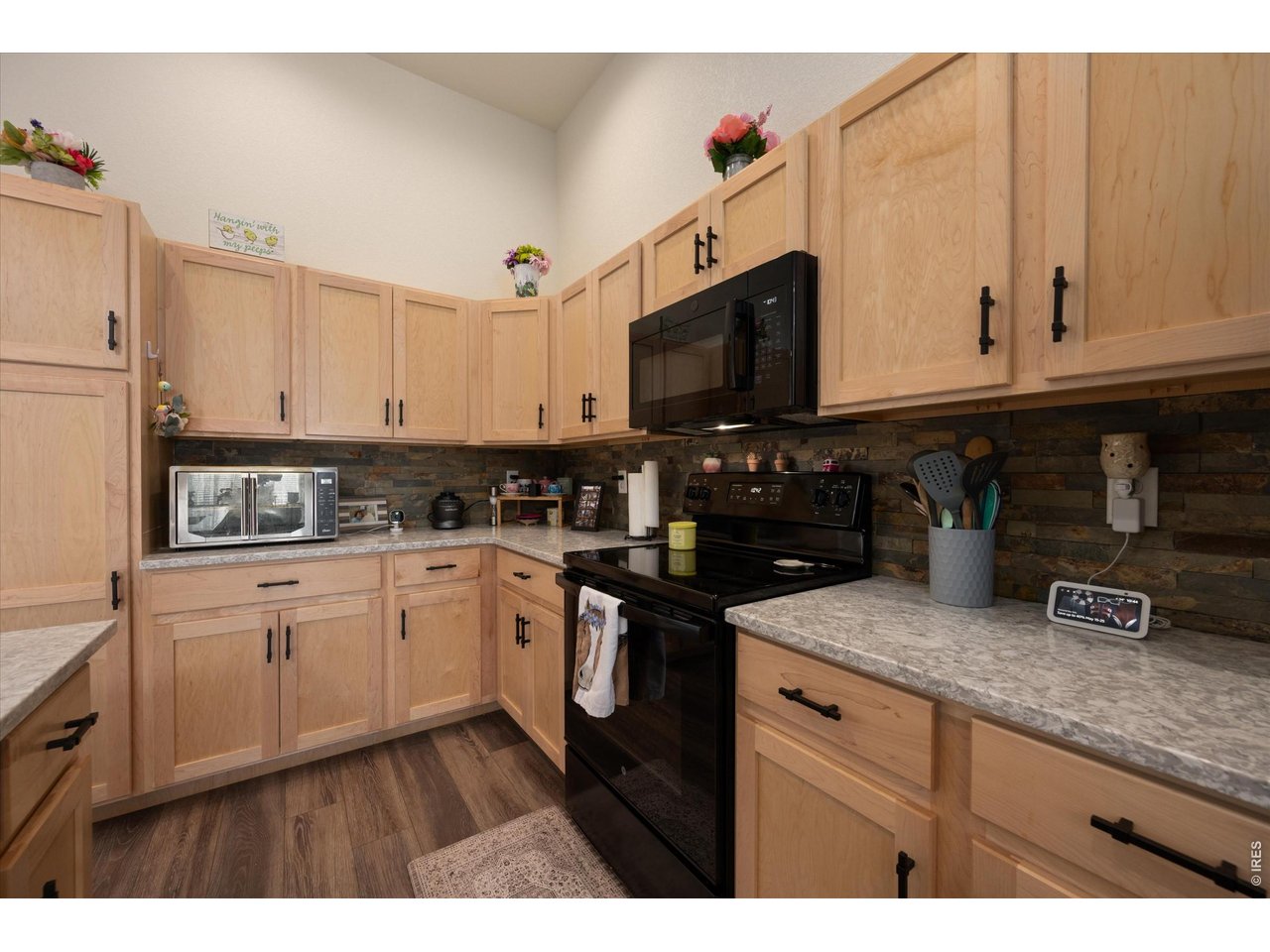 Natural Upgraded Cabinetry with Sleek Black Hardware
