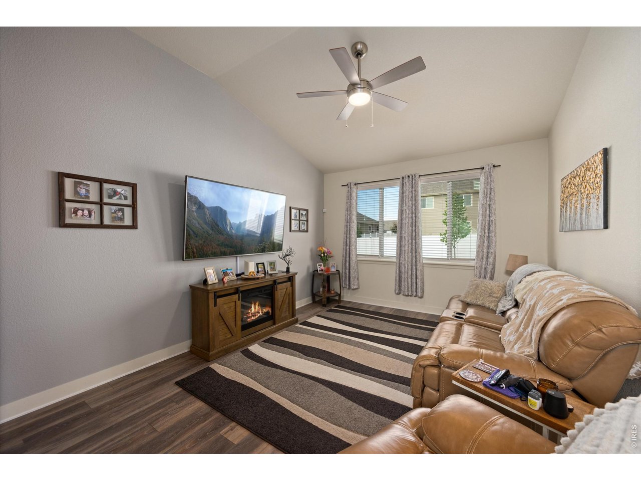Family Room with Vaulted Ceilings & Upgraded Laminate Hardwood Flooring Throughout