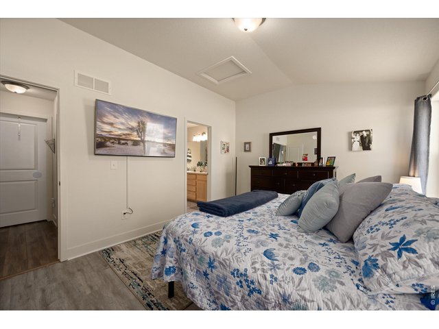 Property Photo 19 Primary Bedroom Opens to En- Suite Full Bath with Large Walk- In Closet