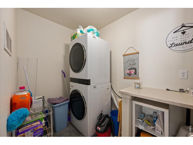 Property Photo 22 Main Floor Laundry Room with Folding Table