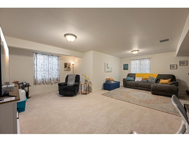Property Photo 30 Rec Space with Large Windows Allowing it to Be Light & Bright!