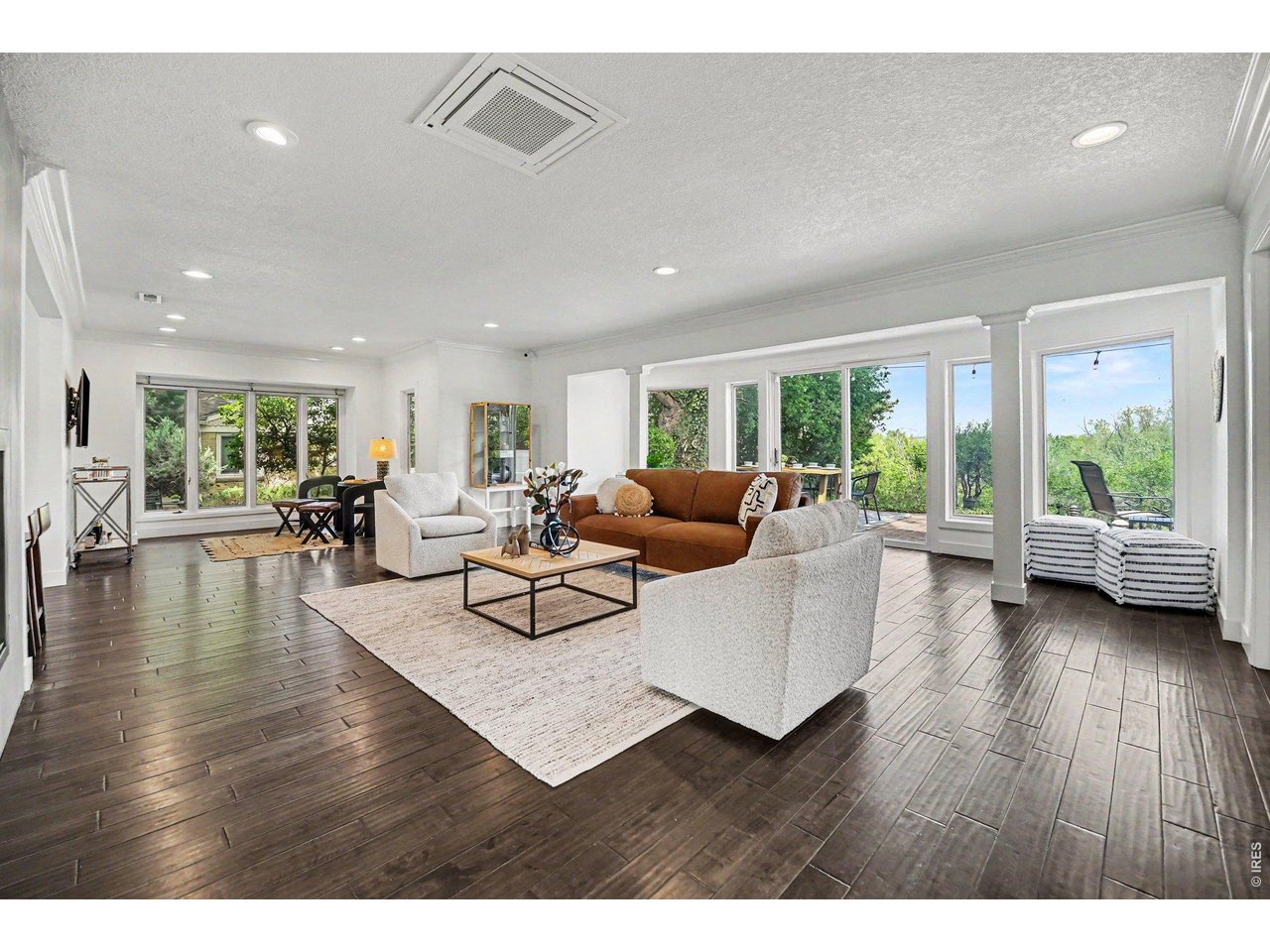 Open-concept main level living. Sliding glass door and large windows flood the space with natural light and offer incredible views.