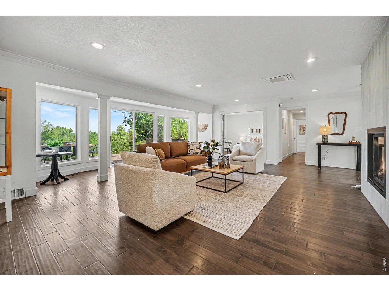 Warm and inviting! This expansive living space features premium wood flooring and recessed lighting. The thoughtful flow connects indoor comfort directly to your private backyard.