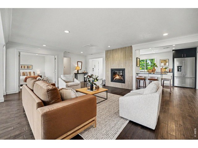 Property Photo 7 Bright and open mid-century soul! This living space pairs a contemporary fireplace with an updated kitchen featuring premium appliances.