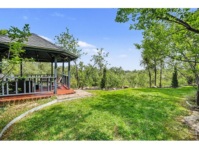 Property Photo 30 Gazebo features a high ceiling, ambient bistro lighting, and a spacious layout perfect for an outdoor living room set up.