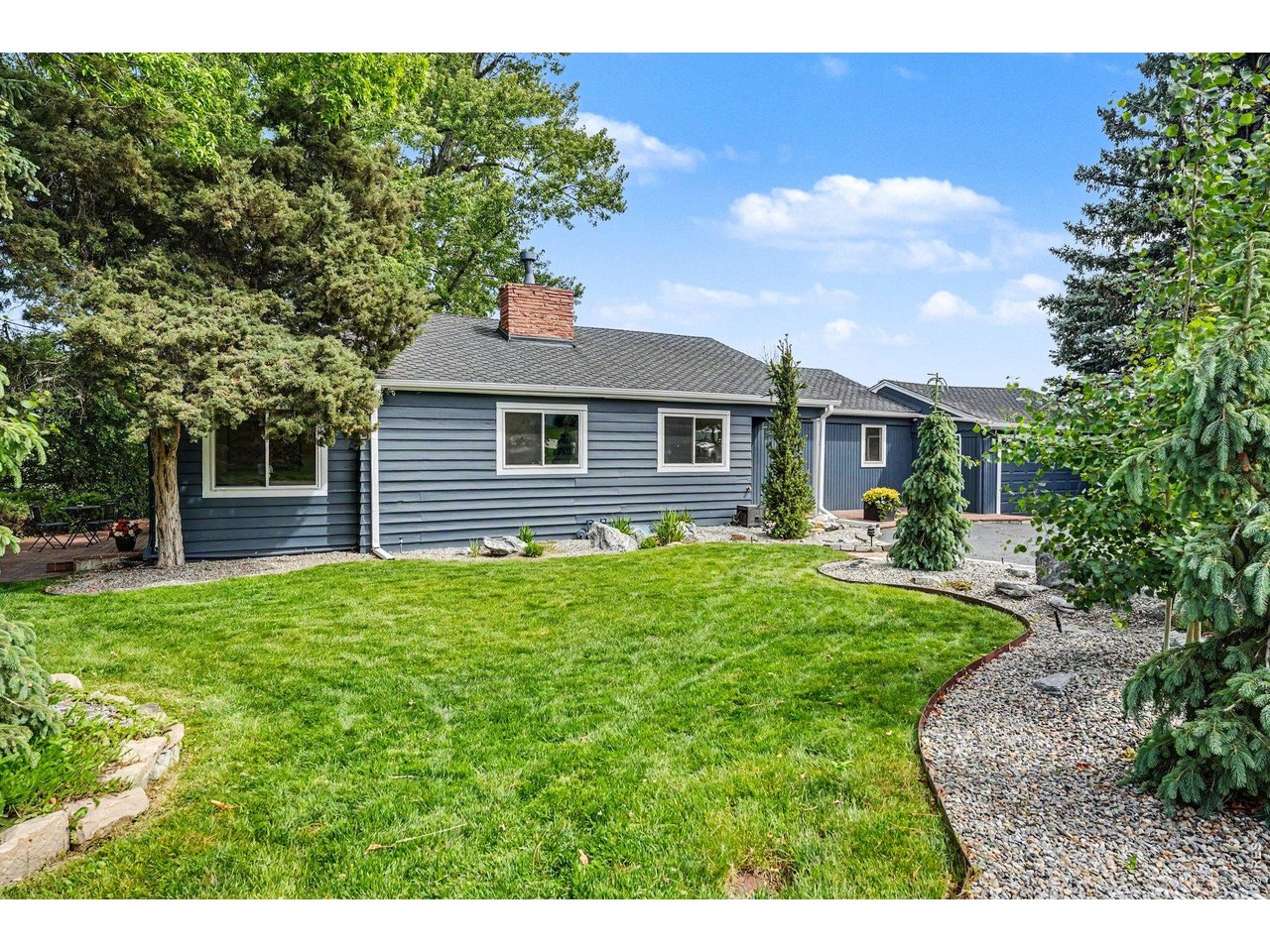 Frame-worthy mature shade trees and a lush, vibrant front lawn create a picturesque, park-like setting for this beautiful Bel Aire property.