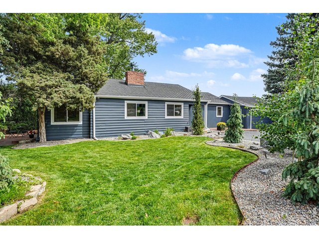 Property Photo 47 Frame-worthy mature shade trees and a lush, vibrant front lawn create a picturesque, park-like setting for this beautiful Bel Aire property.