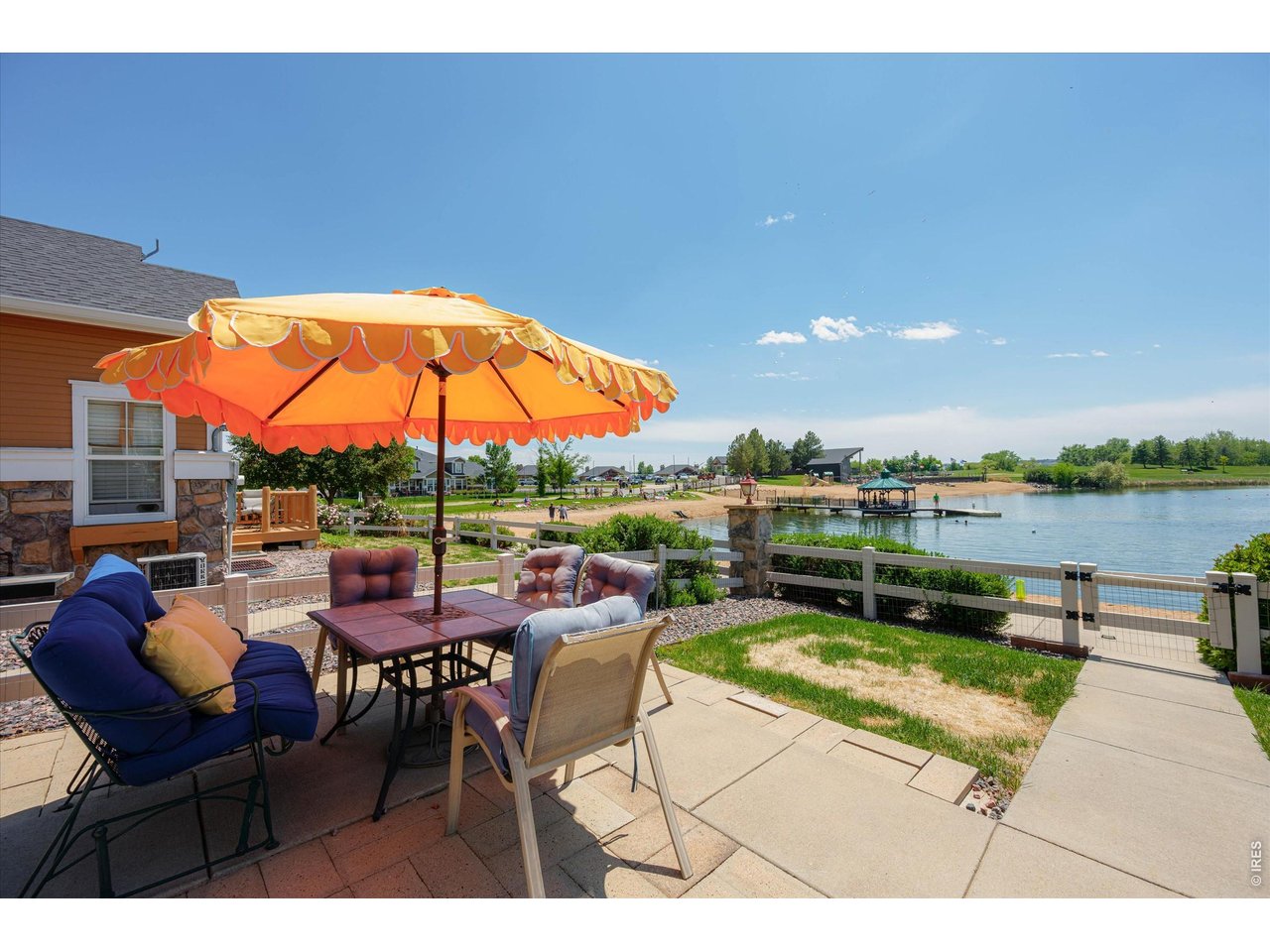 Private Fenced Front Yard & Entry to Townhome Sitting Directly on the Beach Facing the Lake, Golf Course & Mountain Views!