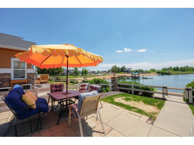 Property Photo 6 Private Fenced Front Yard & Entry to Townhome Sitting Directly on the Beach Facing the Lake, Golf Course & Mountain Views!