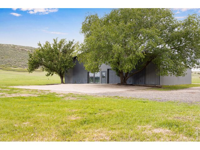 Property Photo 3 Front of barndominium features a 9X8 overhead door