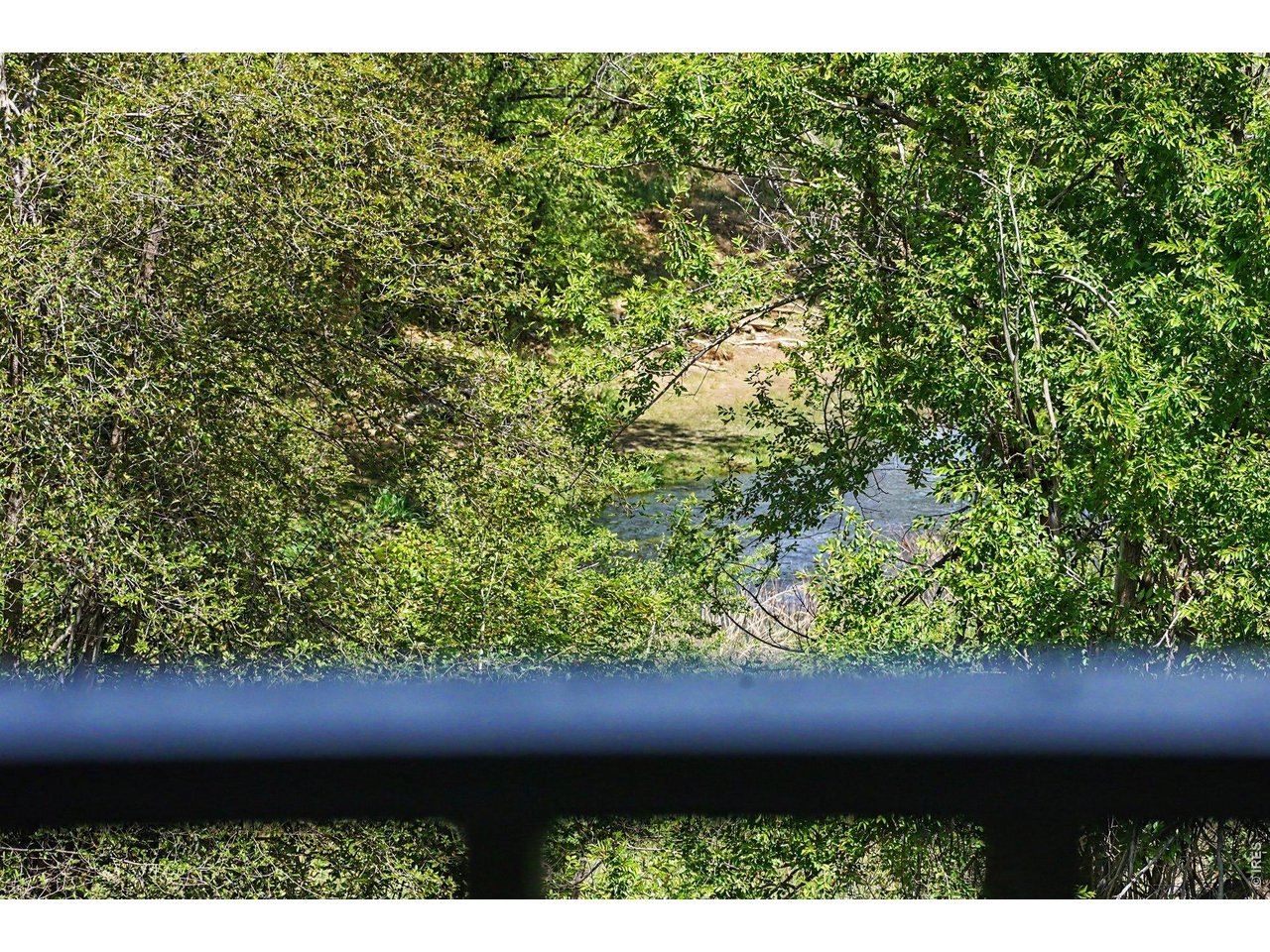Take in peaceful, secluded water views looking out toward Clear Creek River right from the gazebo, surrounded by lush mature trees and natural beauty.