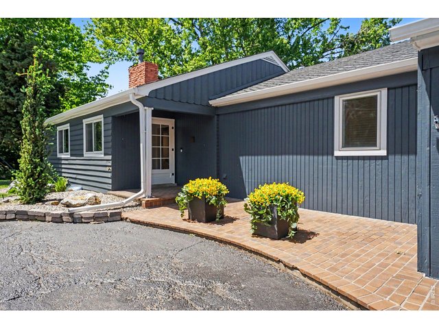 Property Photo 4 A welcoming brick walkway leads to the covered front entrance of this charming home.