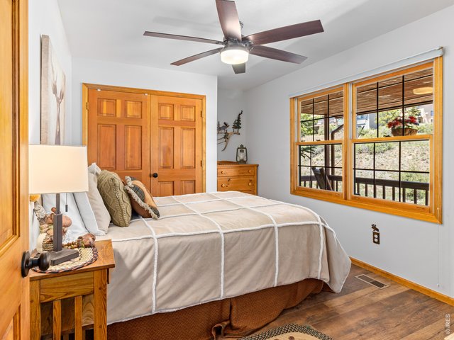 Property Photo 33 2nd Main level bedroom large window looking out on to front porch 