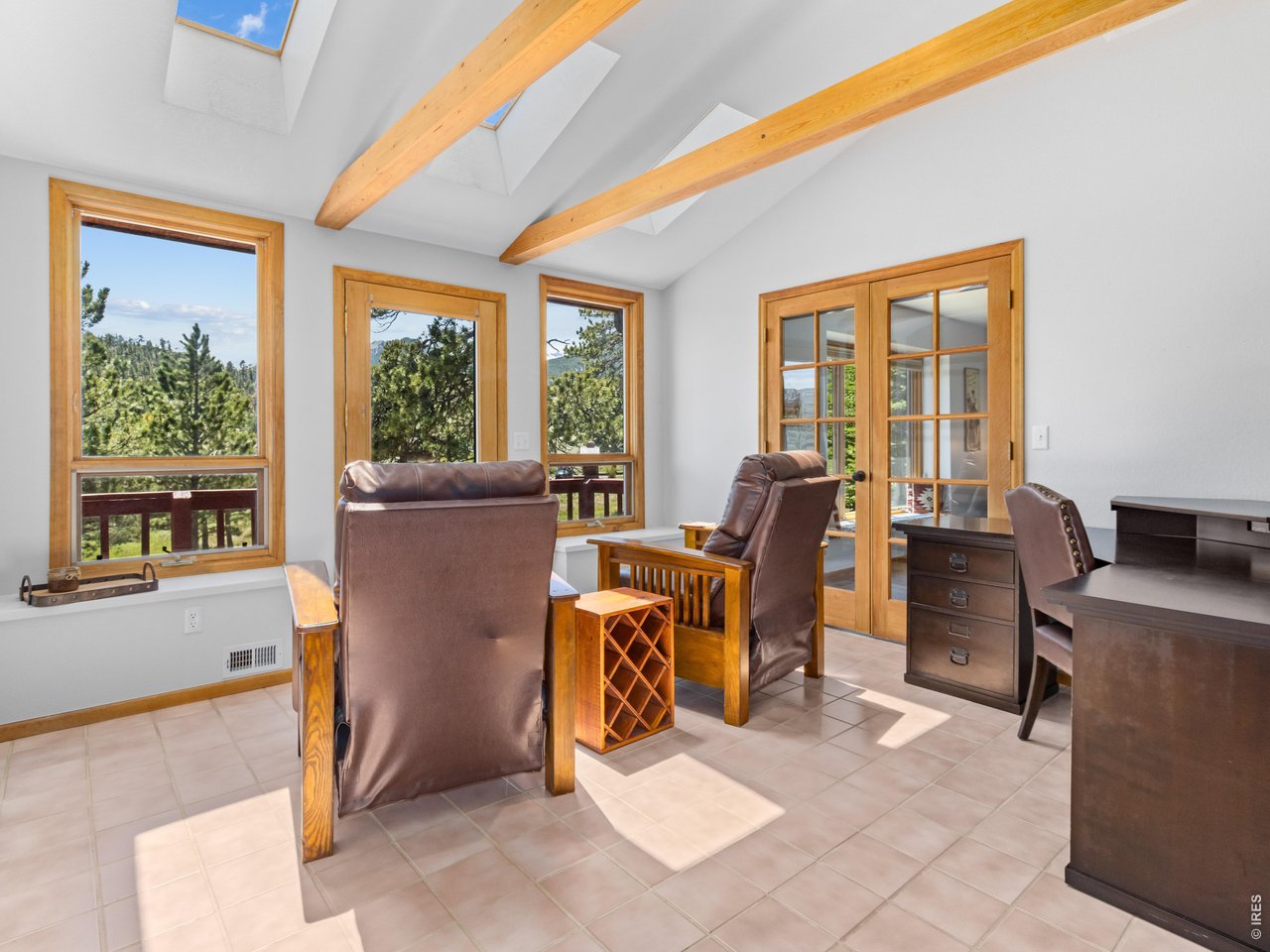 Sunroom/office, vaulted ceiling,with wood beams and skylights, 