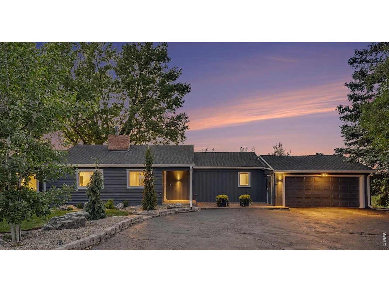 This beautifully modernized mid-century features mature landscaping, brick walkway, and a fresh exterior paint job.