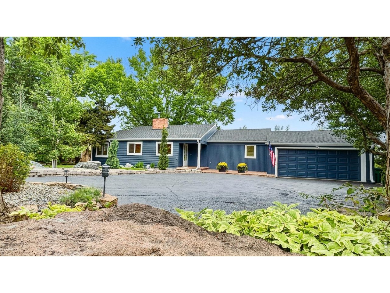 Enjoy beautiful, professional landscaping featuring perfectly manicured rock garden beds and thoughtful, low-maintenance design that enhances the home's exterior.