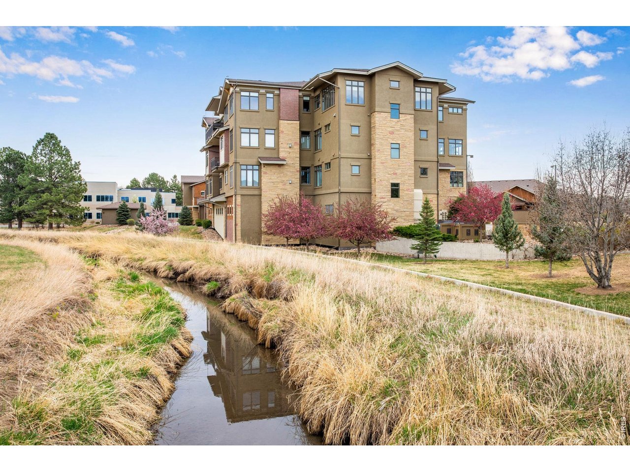 Mid-Town setting, admist open area & quick access shopping, restaurants, medical facilities, the Spring Creek trails and The Gardens on Spring Creek. 