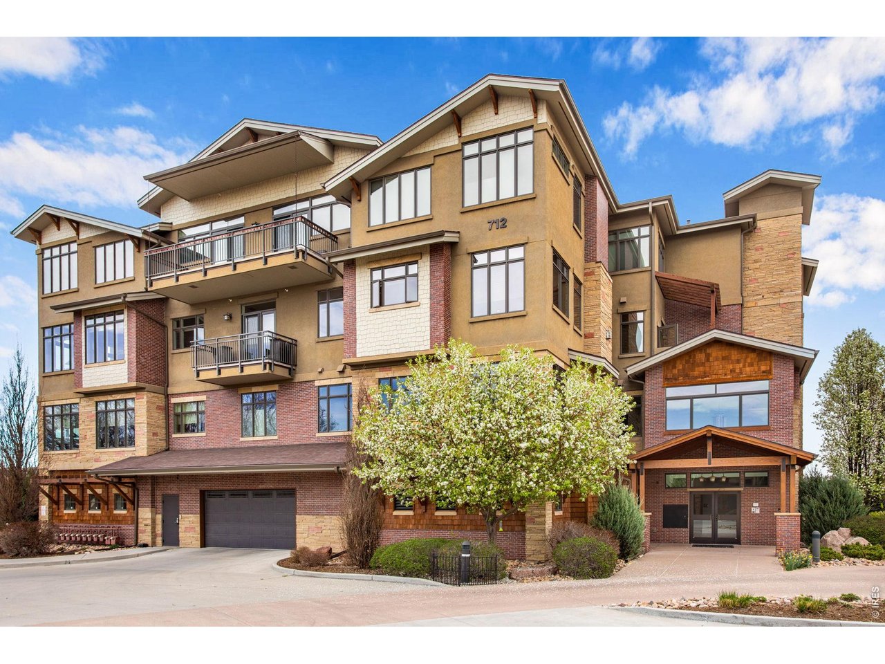 South side main entrance and main level secure parking. Dynamic exterior, gorgeous materials adorn all 4 levels. 