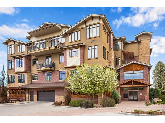 Property Photo 5 South side main entrance and main level secure parking. Dynamic exterior, gorgeous materials adorn all 4 levels. 