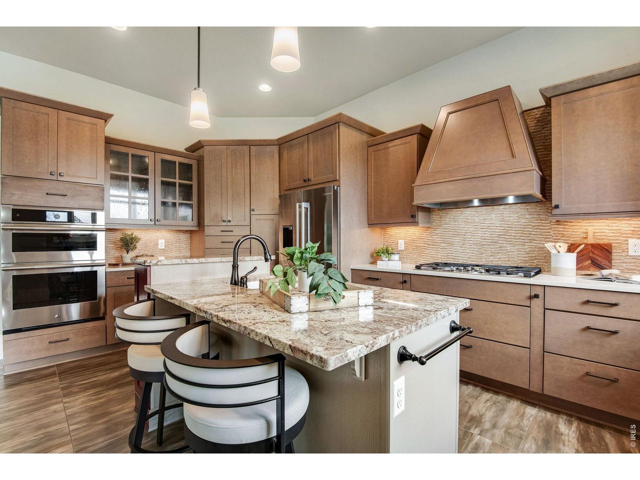 Slab Granite, Newer Stainless Steel appliances. Jennair wall ovens, dual cast-iron sinks.